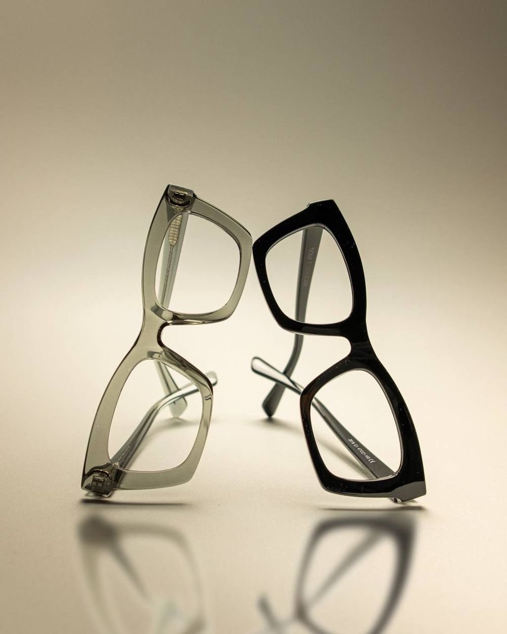 Two frames balanced against each other with reflections