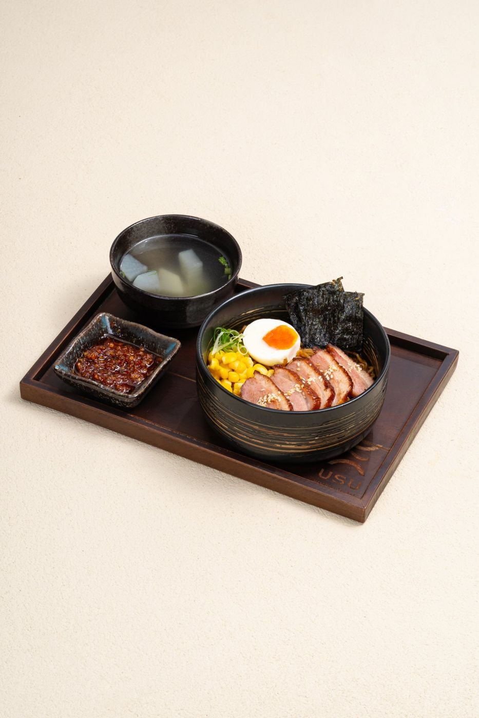 Ramen set with soup and chilli oil on a USU tray