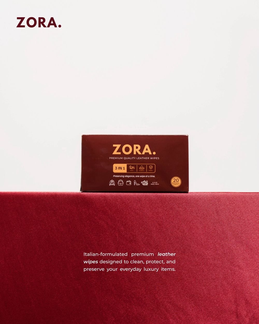 ZORA leather wipes box resting on red fabric
